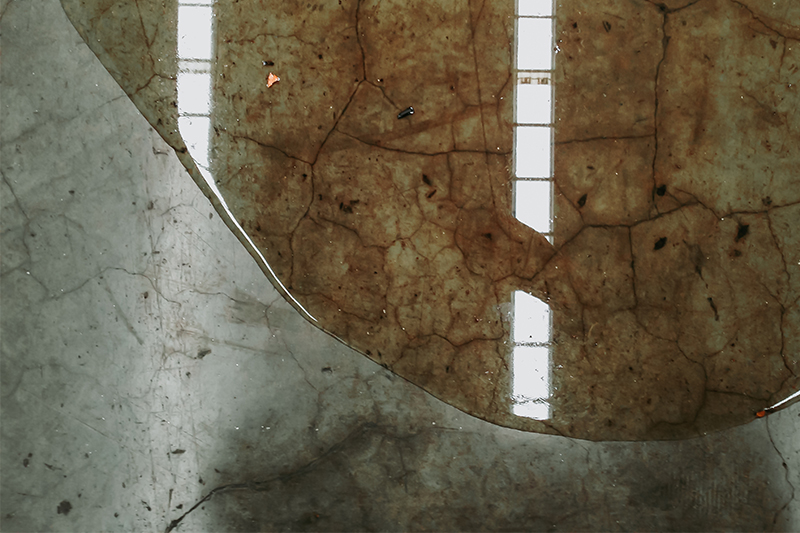 Image of a water leak on concrete floor
